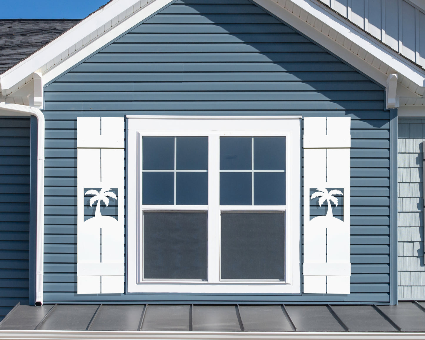 Palm tree shutters. Exterior board and batten style coastal window shutters with tropical palm tree cutout. Weatherproof PVC beach house shutters for outdoor decor.